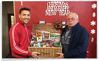 Christmas Hamper winner Mr Ron Gibson and Stephen Wyss Homestead Caravans Accessory Showroom Manager