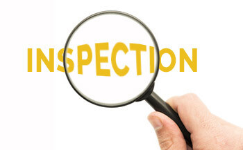The word inspection under a magnifying glass