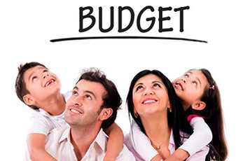 Family looking up at the word budget